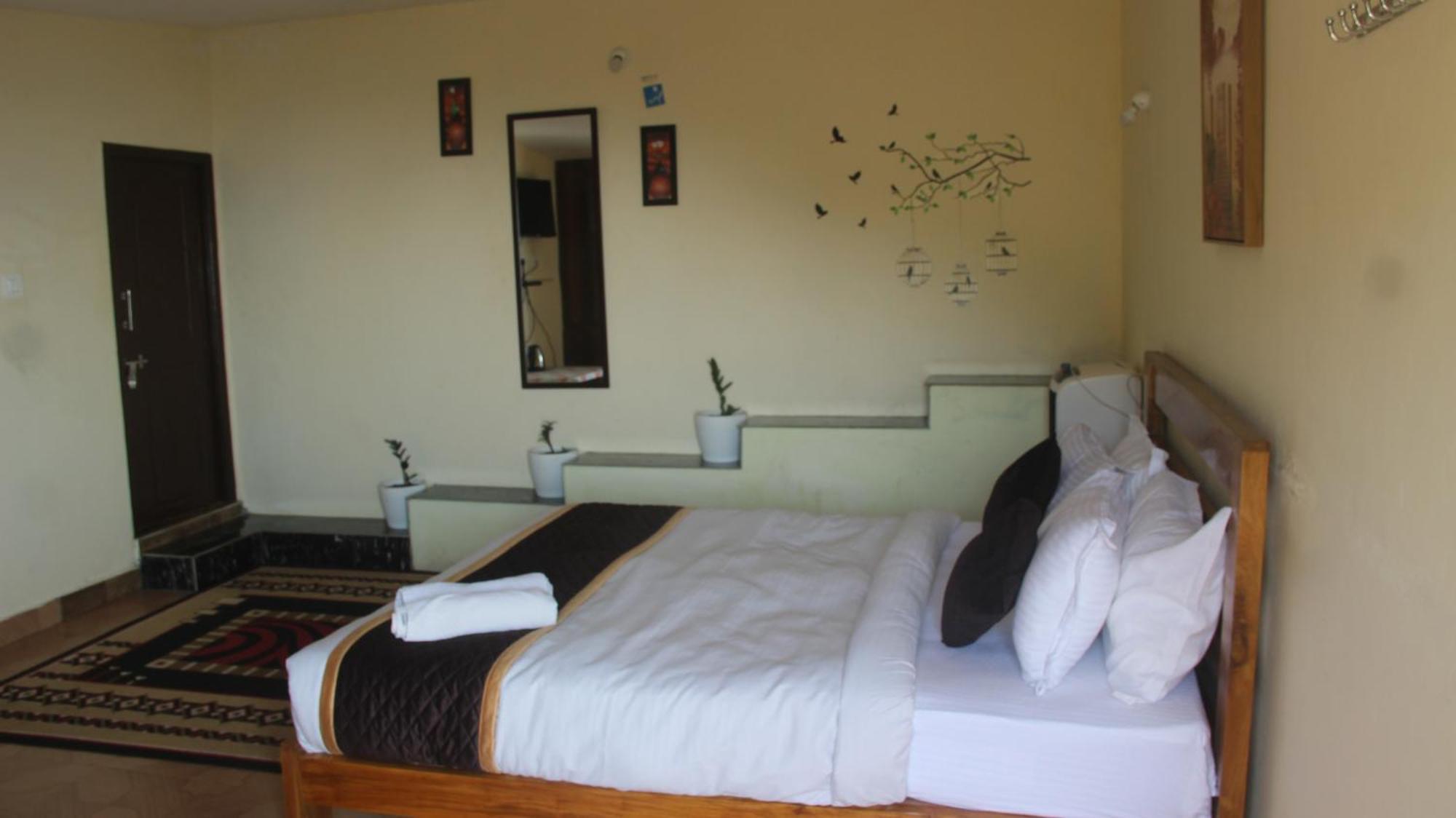Kollanoor Guest House Madikeri Quarto foto